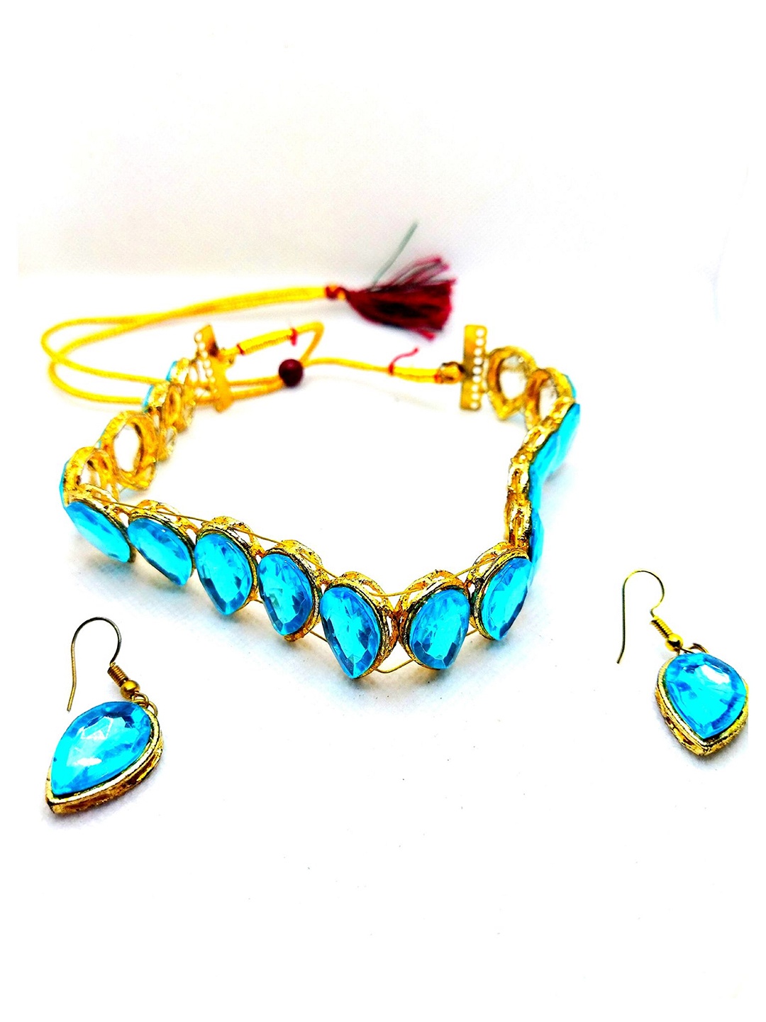 

Kshitij Jewels Gold-Plated Turquoise Blue Stone-Studded & Pearl Beaded Jewellery Set