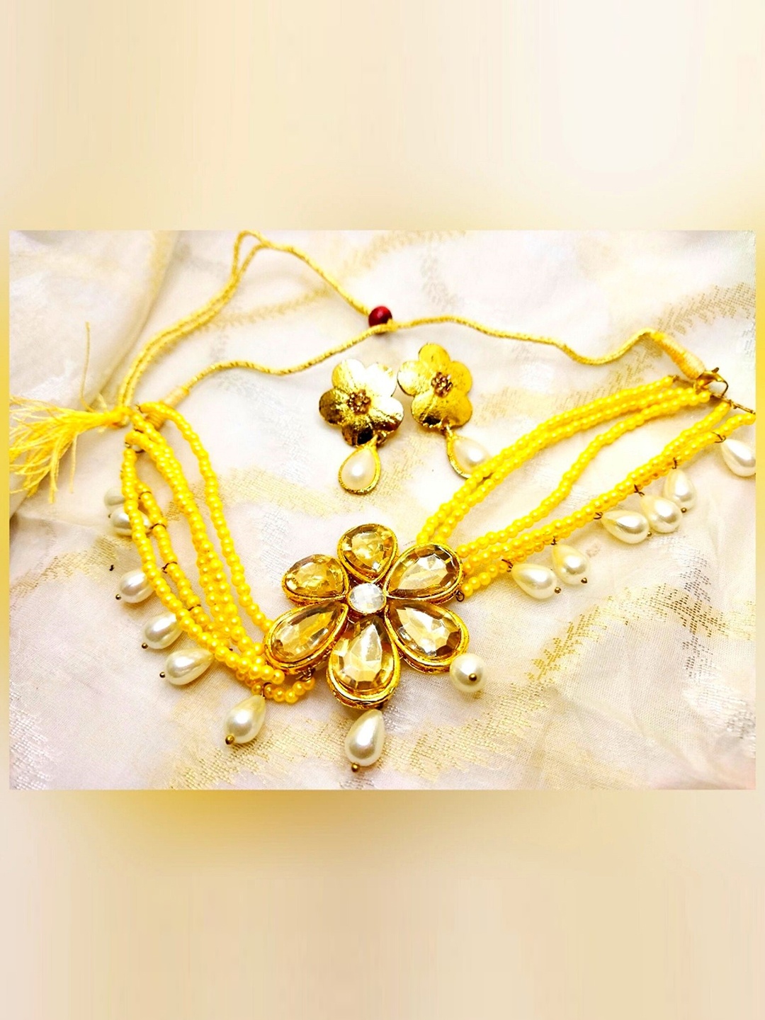 

Kshitij Jewels Yellow Gold-plated Stone Studded Handcrafted Jewellery Set