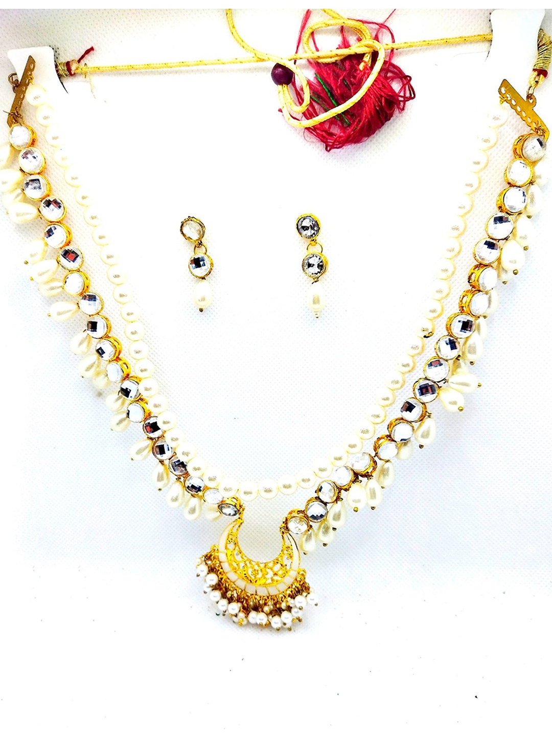 

Kshitij Jewels Gold-Plated & Toned White Artificial Stones and Beads Jewellery Set