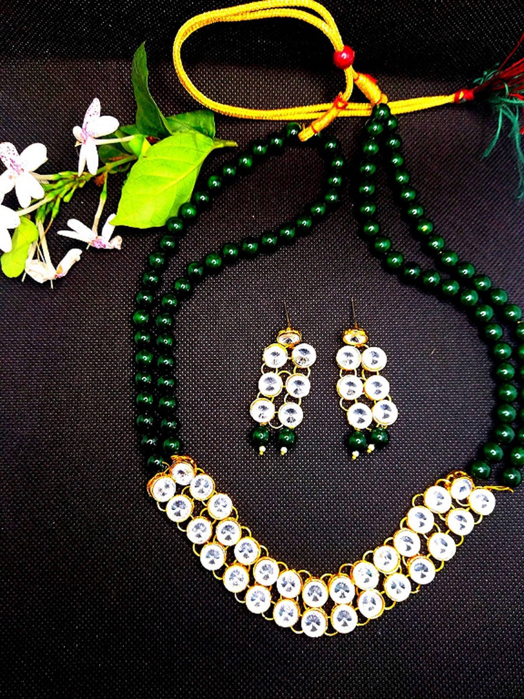 

Kshitij Jewels Gold-Plated Green Artificial Stone Studded & Beaded Jewellery Set