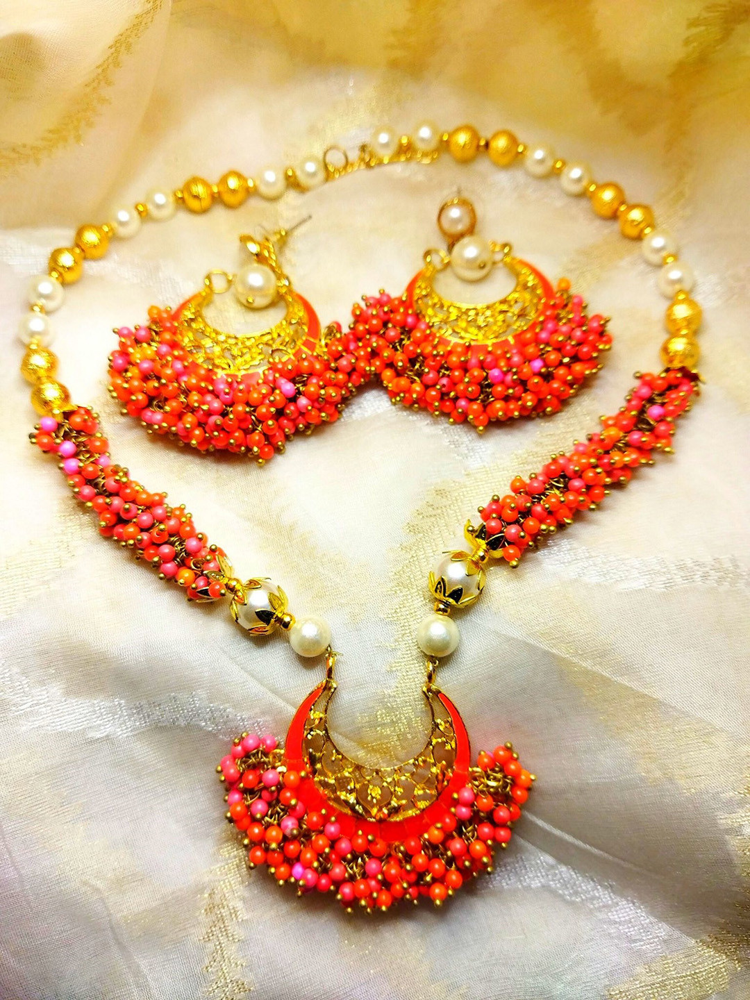 

Kshitij Jewels Gold-Plated Orange Stone-Studded & Pearl Beaded Choker Jewellery Set