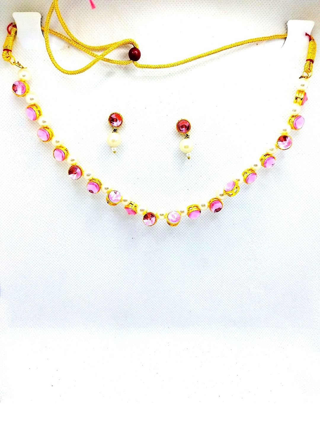 

Kshitij Jewels Gold-Plated & Toned Pink Kundan Studded Jewellery Set