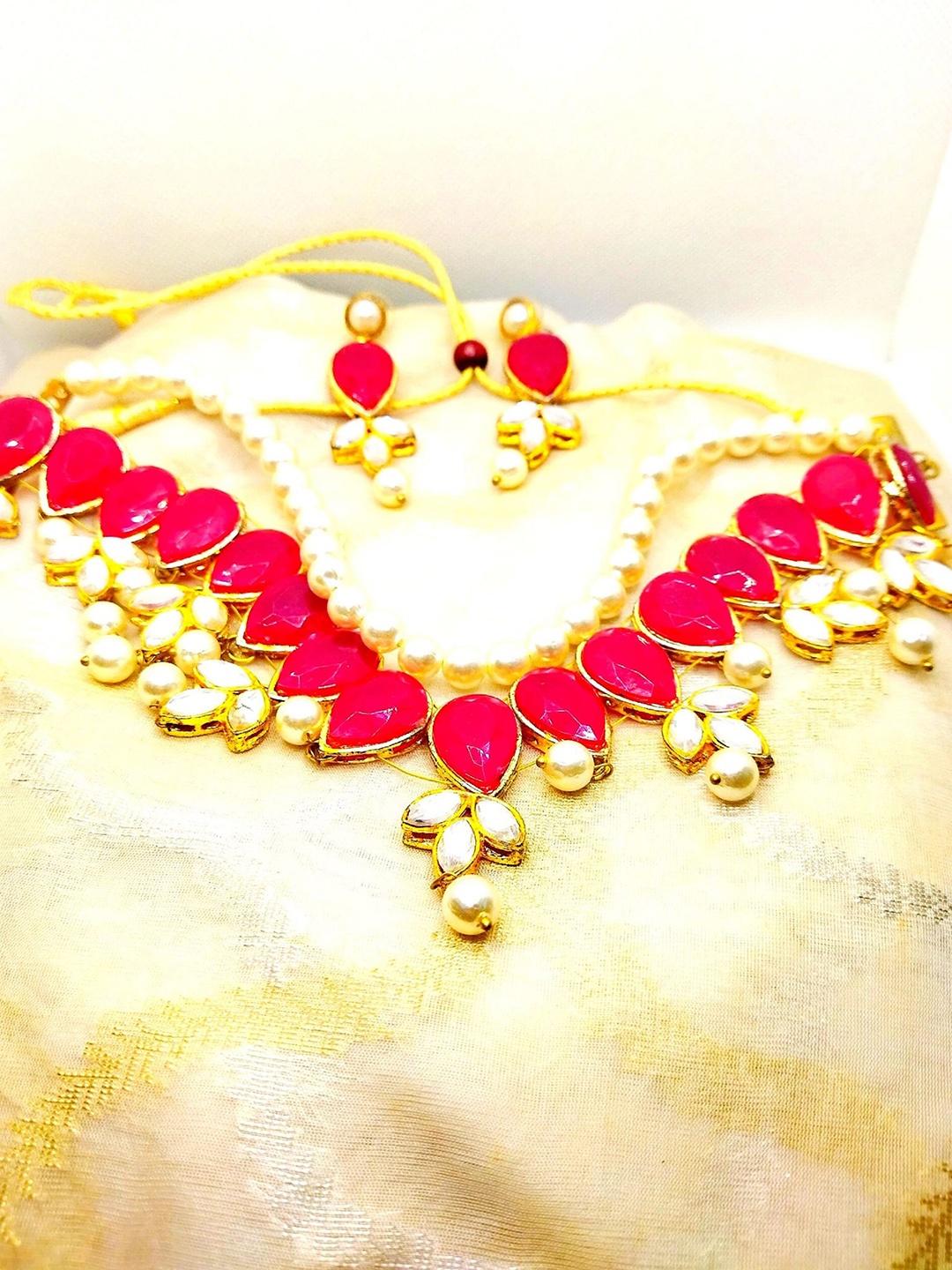

Kshitij Jewels Gold-Plated Red & White Stone-Studded Jewellery Set