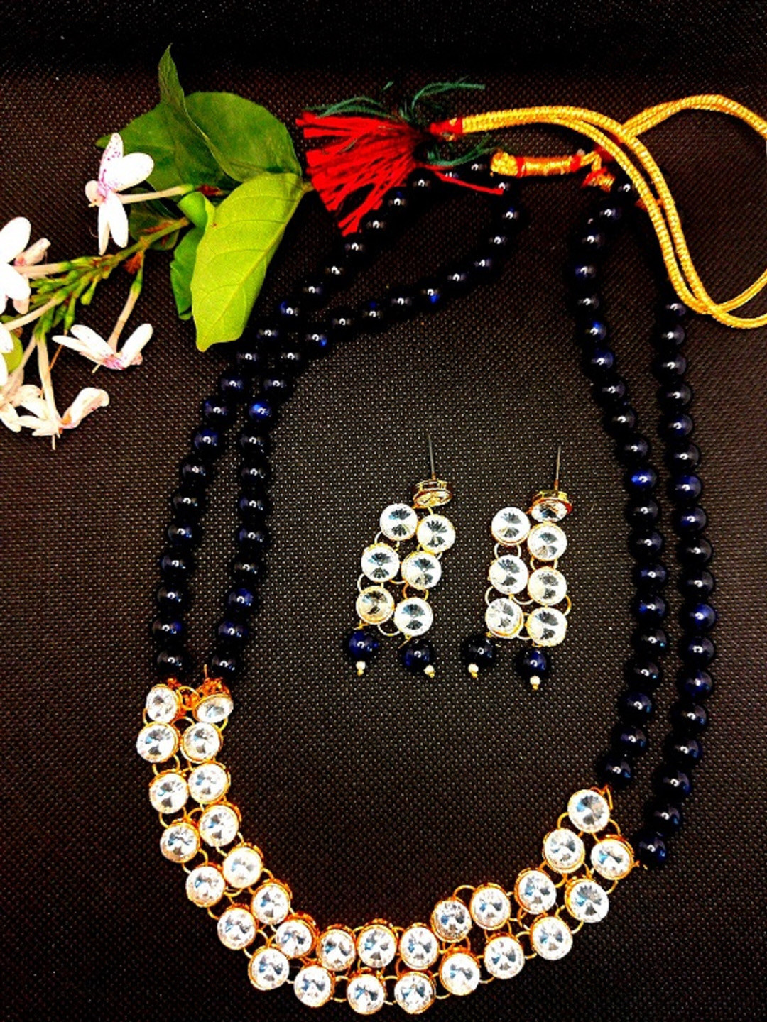 

Kshitij Jewels Gold-Plated White & Black Stone-Studded & Pearl Beaded Jewellery Set
