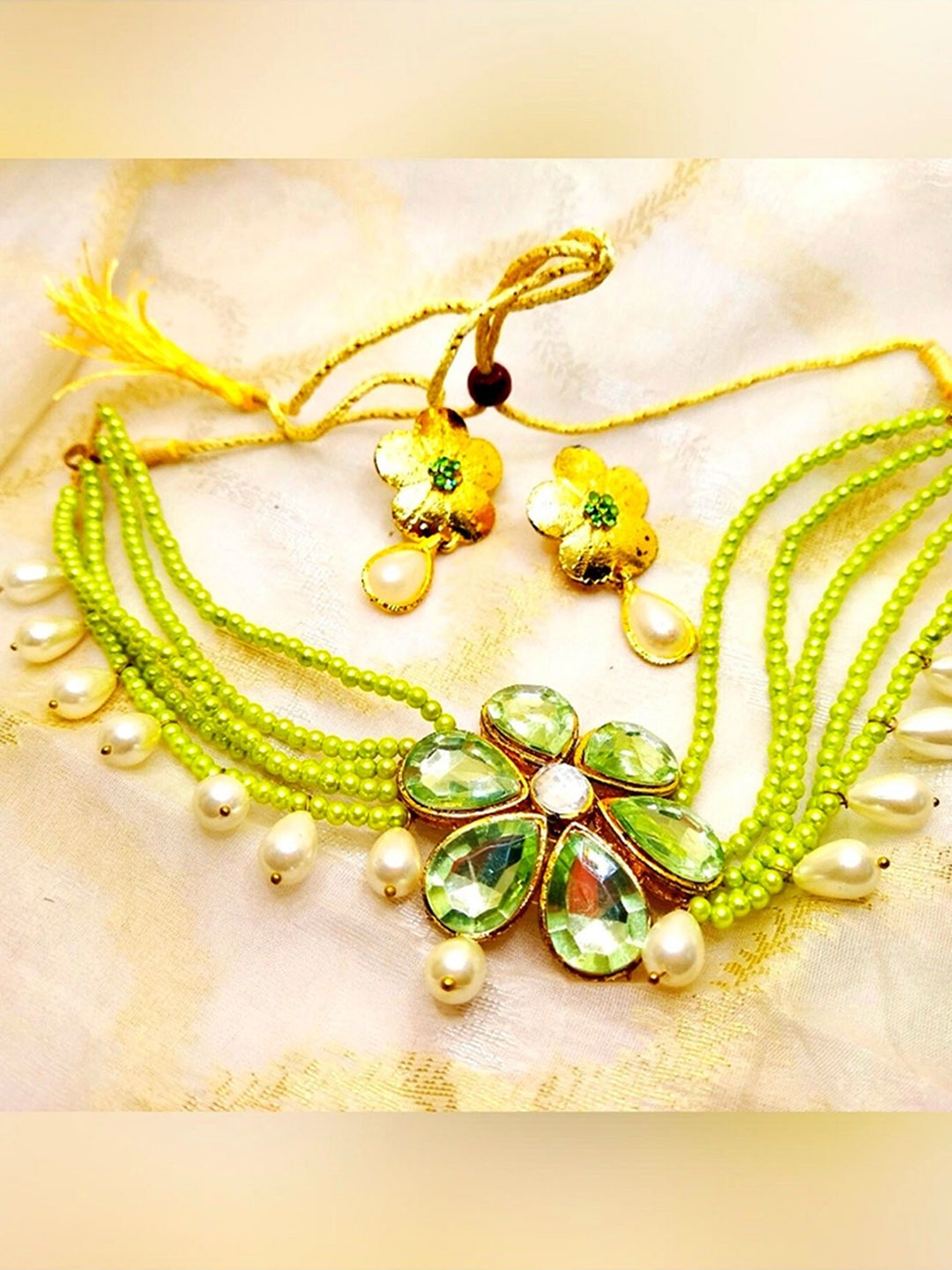 

Kshitij Jewels Gold-Plated Fluorescent Green Stone-Studded & Beaded Jewellery Set