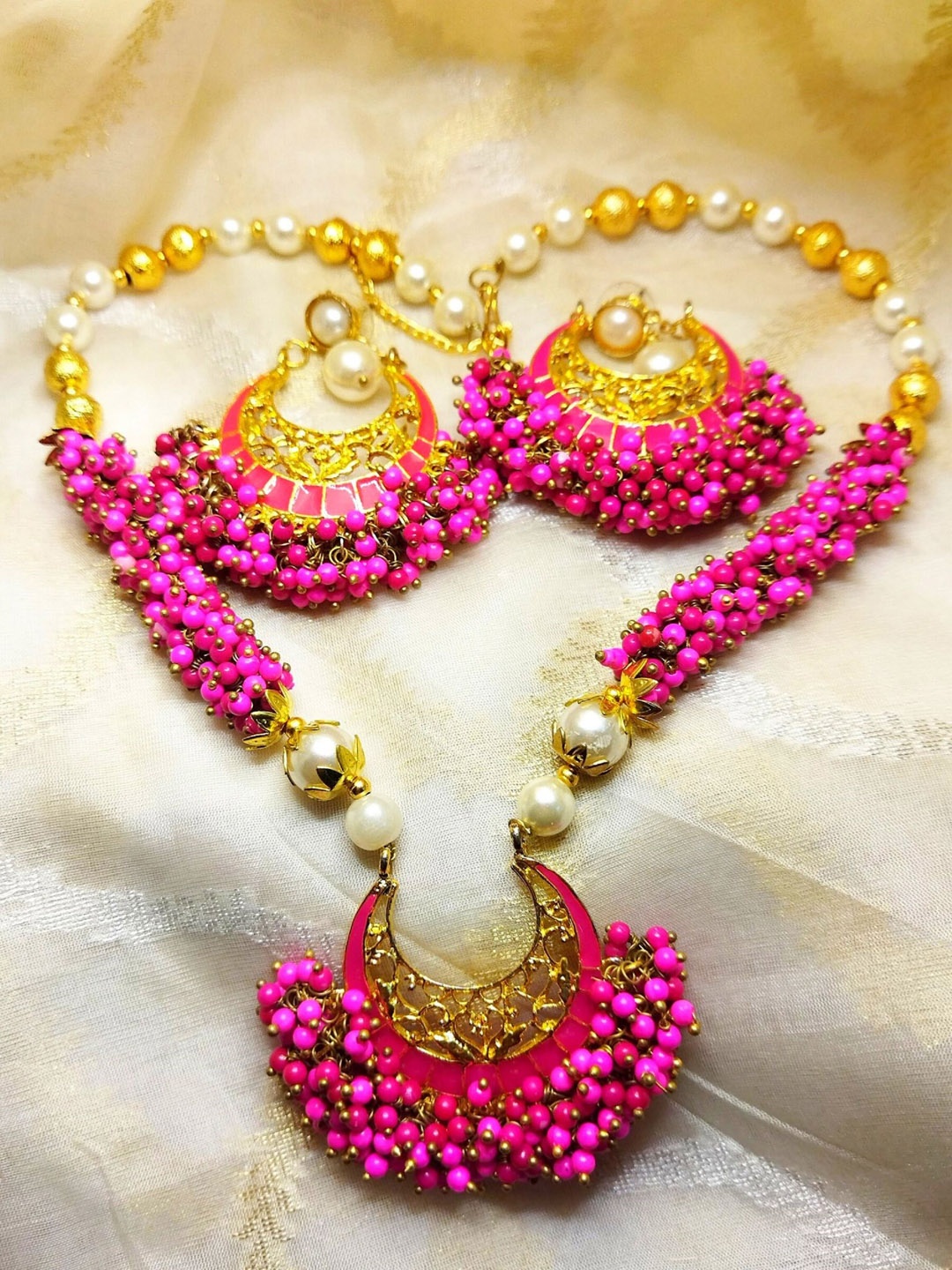 

Kshitij Jewels Gold-plated Fuchsia Stone-Studded & Beaded Jewellery Set