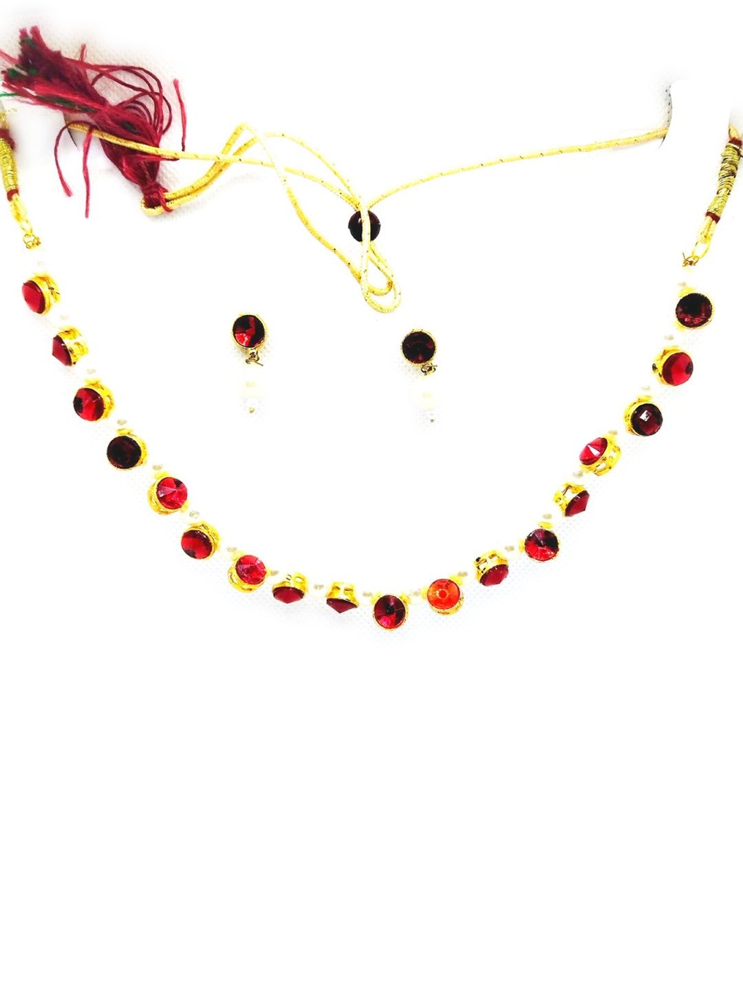 

Kshitij Jewels Gold-Plated White & Red Stone-Studded & Pearl Beaded Jewellery Set