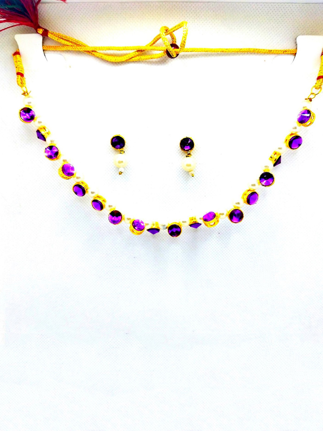 

Kshitij Jewels Gold-Plated Purple Stone-Studded & Pearl Beaded Choker Jewellery Set