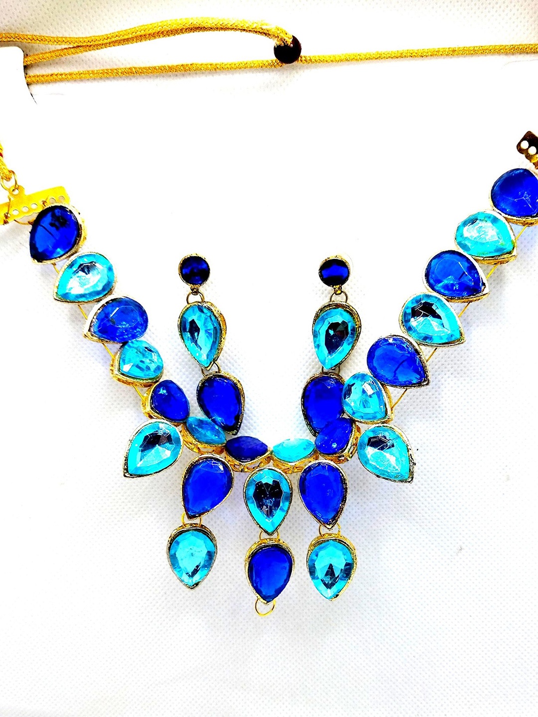 

Kshitij Jewels Gold-Plated Blue Stone-Studded Jewellery Set