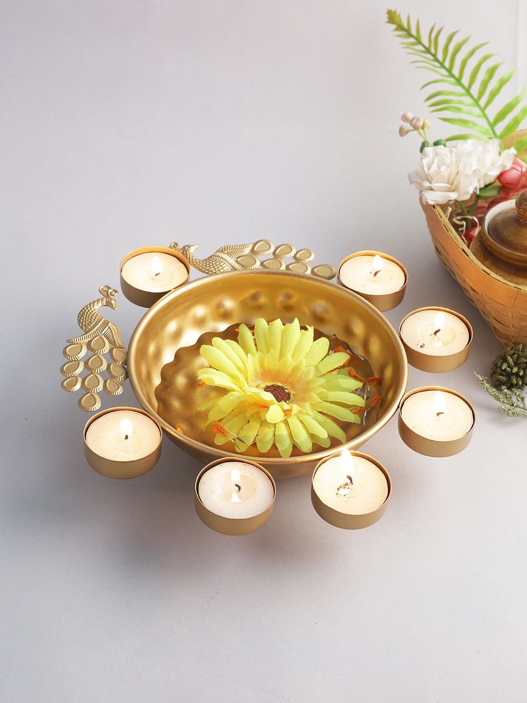 

Aapno Rajasthan Gold-Toned Textured Urli Showpiece With 7 Tea-Light Candle Holder Set