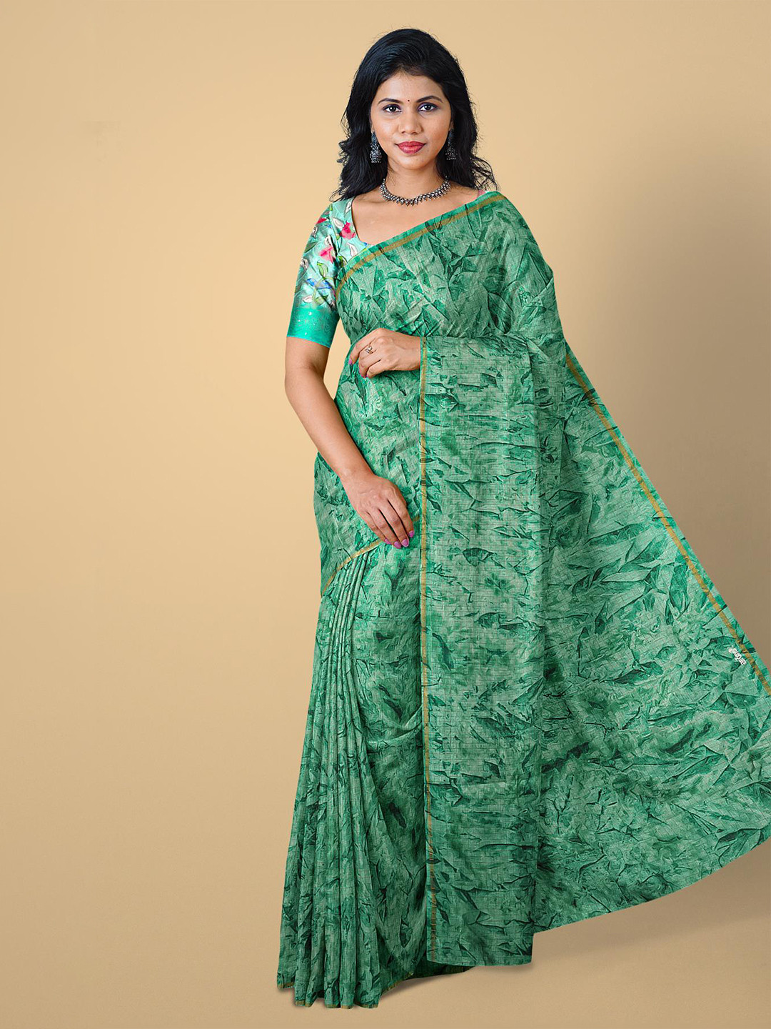 

Kalamandir Sea Green & Gold-Toned Printed Jute Cotton Saree