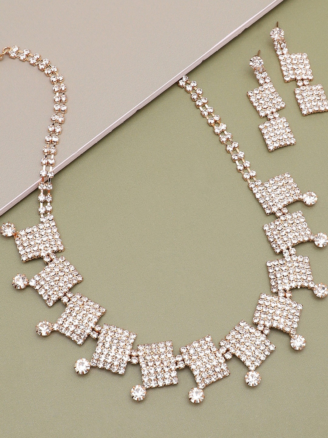 

SOHI Gold-Plated White Artificial Stone Studded Jewellery Set