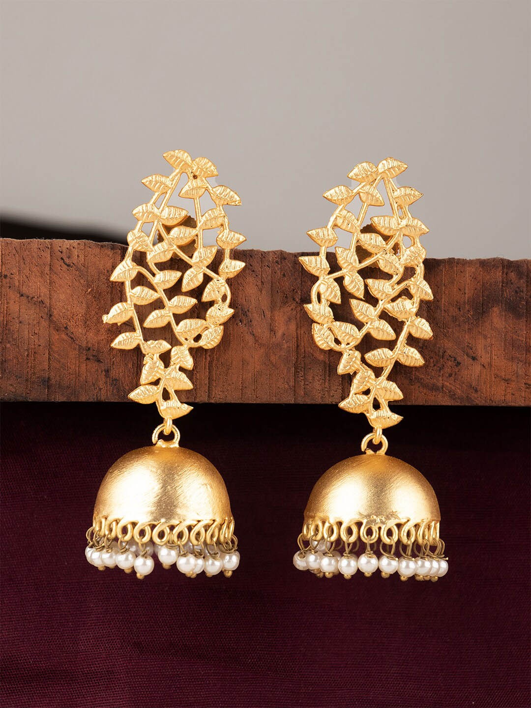 

Ozanoo Gold-Toned Leaf Shaped Jhumkas Earrings