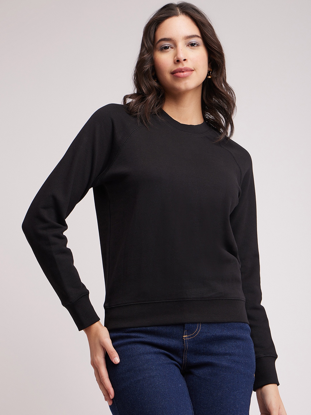 

FableStreet Women Black Solid Sweatshirt