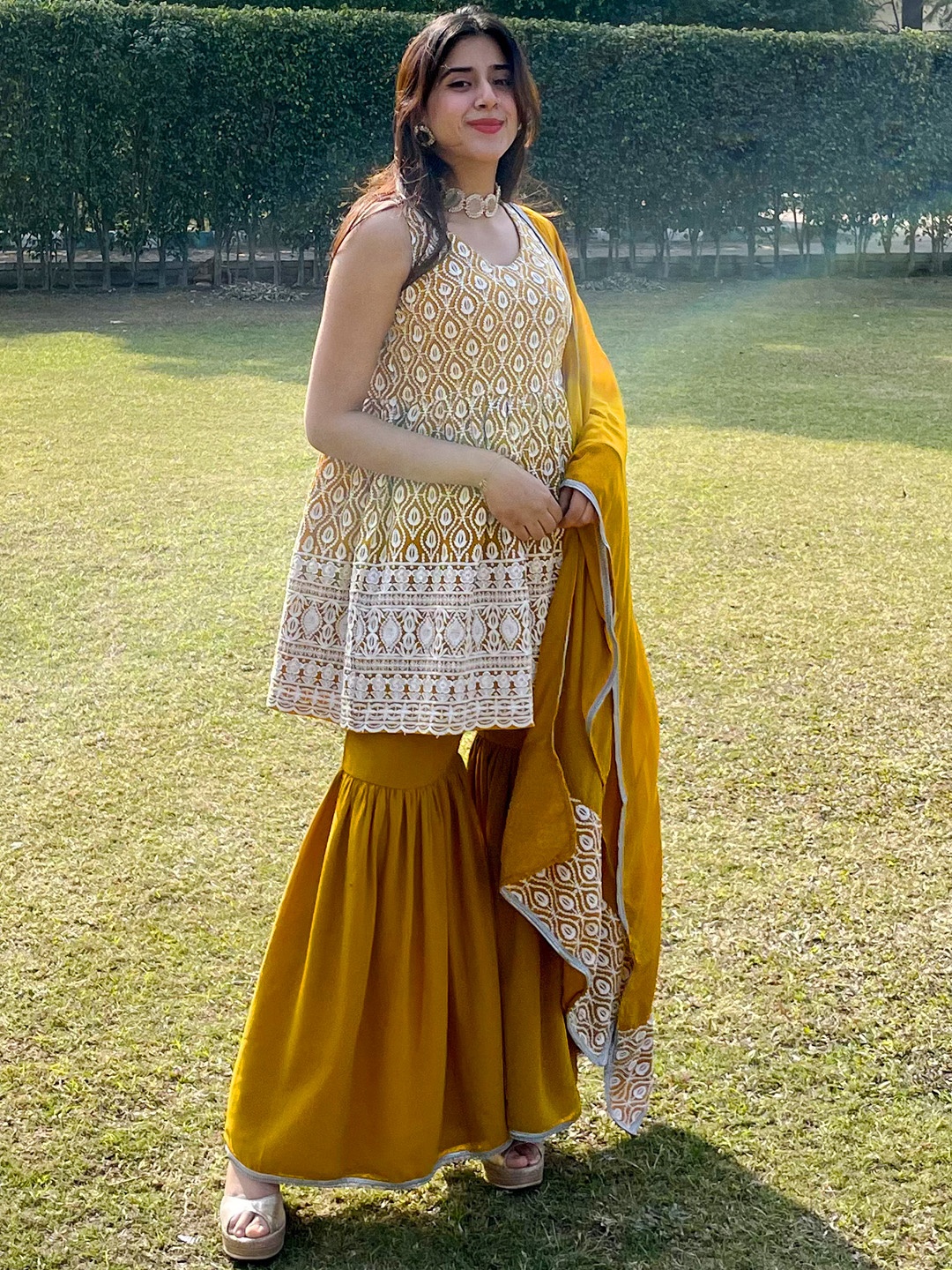 

Libas Women Ethnic Motifs Embroidered Pleated Kurti Set With Dupatta & Potli, Mustard