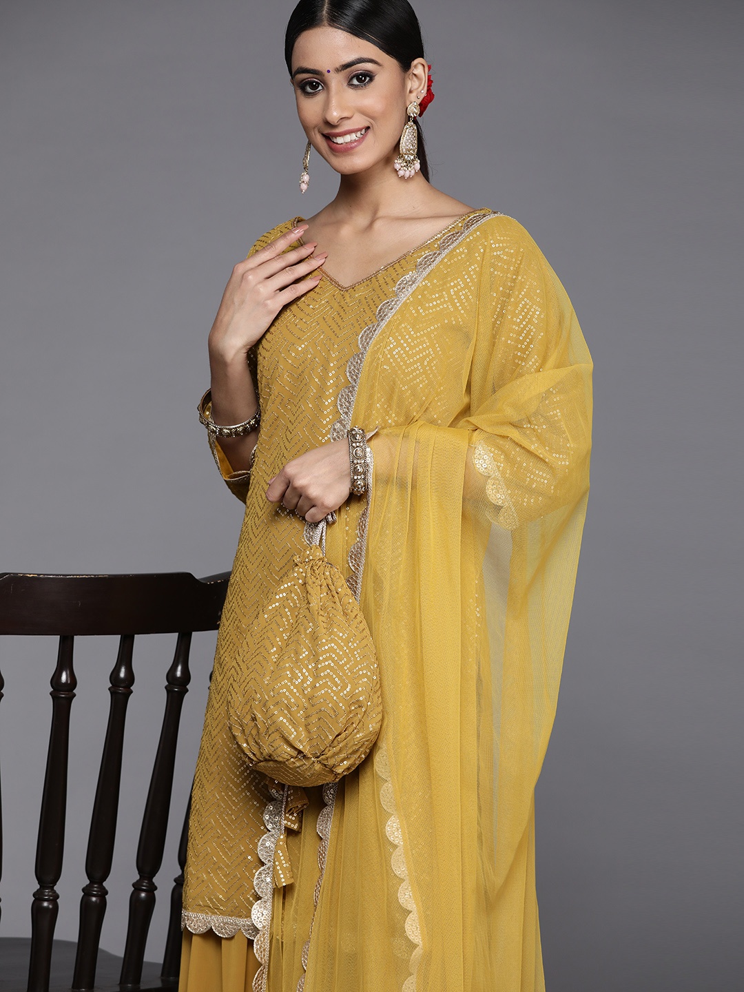 

Libas Women Mustard Yellow Embroidered Sequinned Kurta & Sharara With Dupatta & Potli