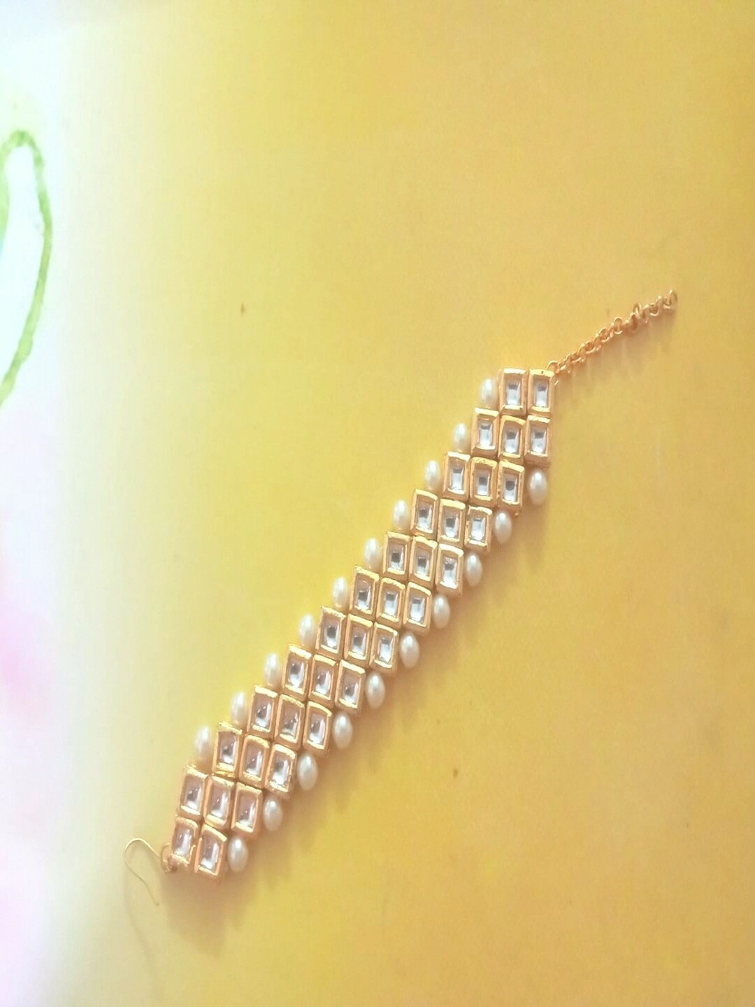 

Runjhun Women Gold-Toned & White Brass Kundan Gold-Plated Link Bracelet