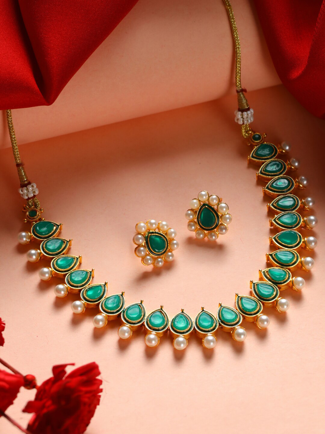

Priyaasi Gold-Plated Green Stone-Studded & White Pearl-Beaded Jewellery Set