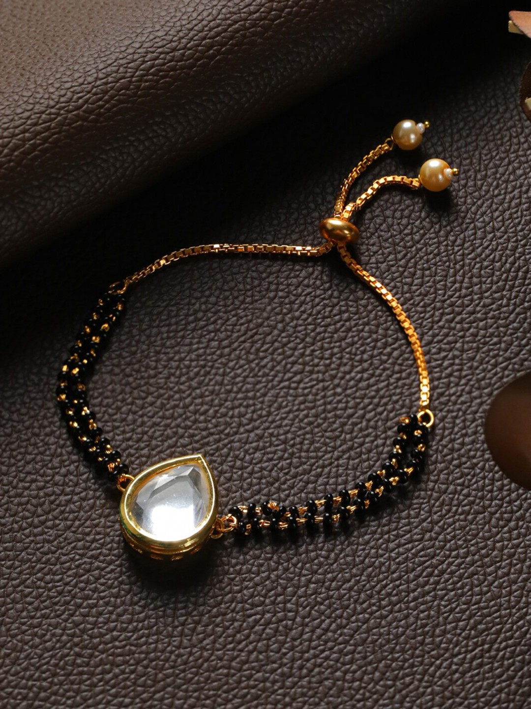 

Priyaasi Women Black Brass Kundan Gold-Plated Link Bracelet