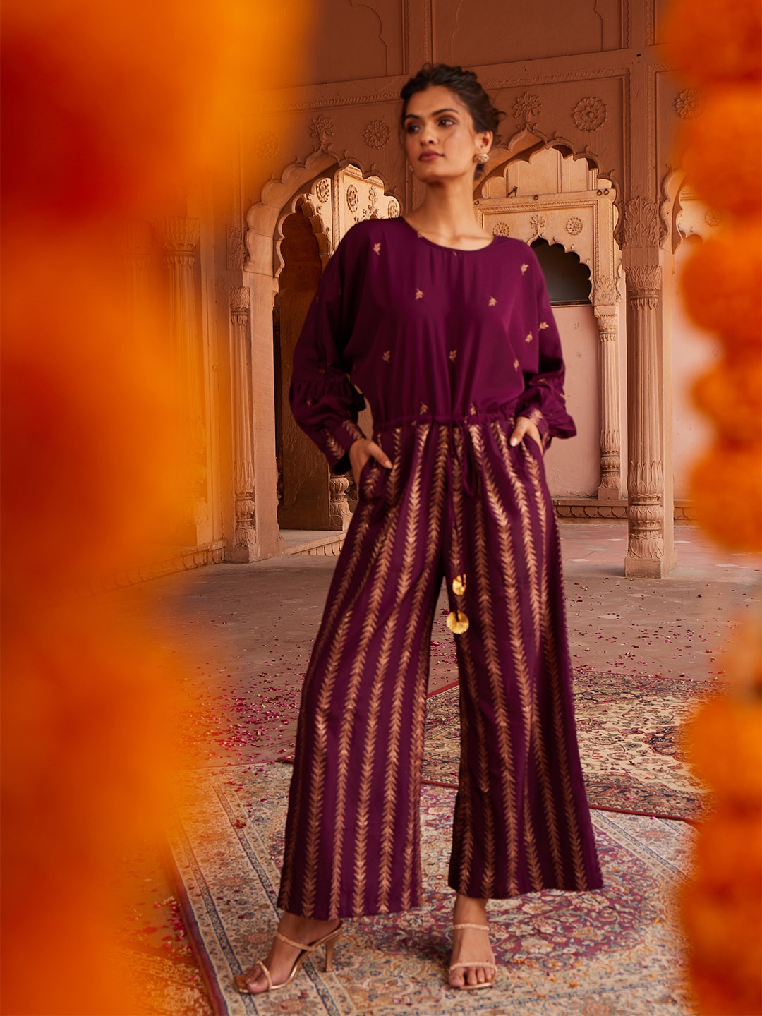 

Ahalyaa Purple & Golden Printed Basic Jumpsuit