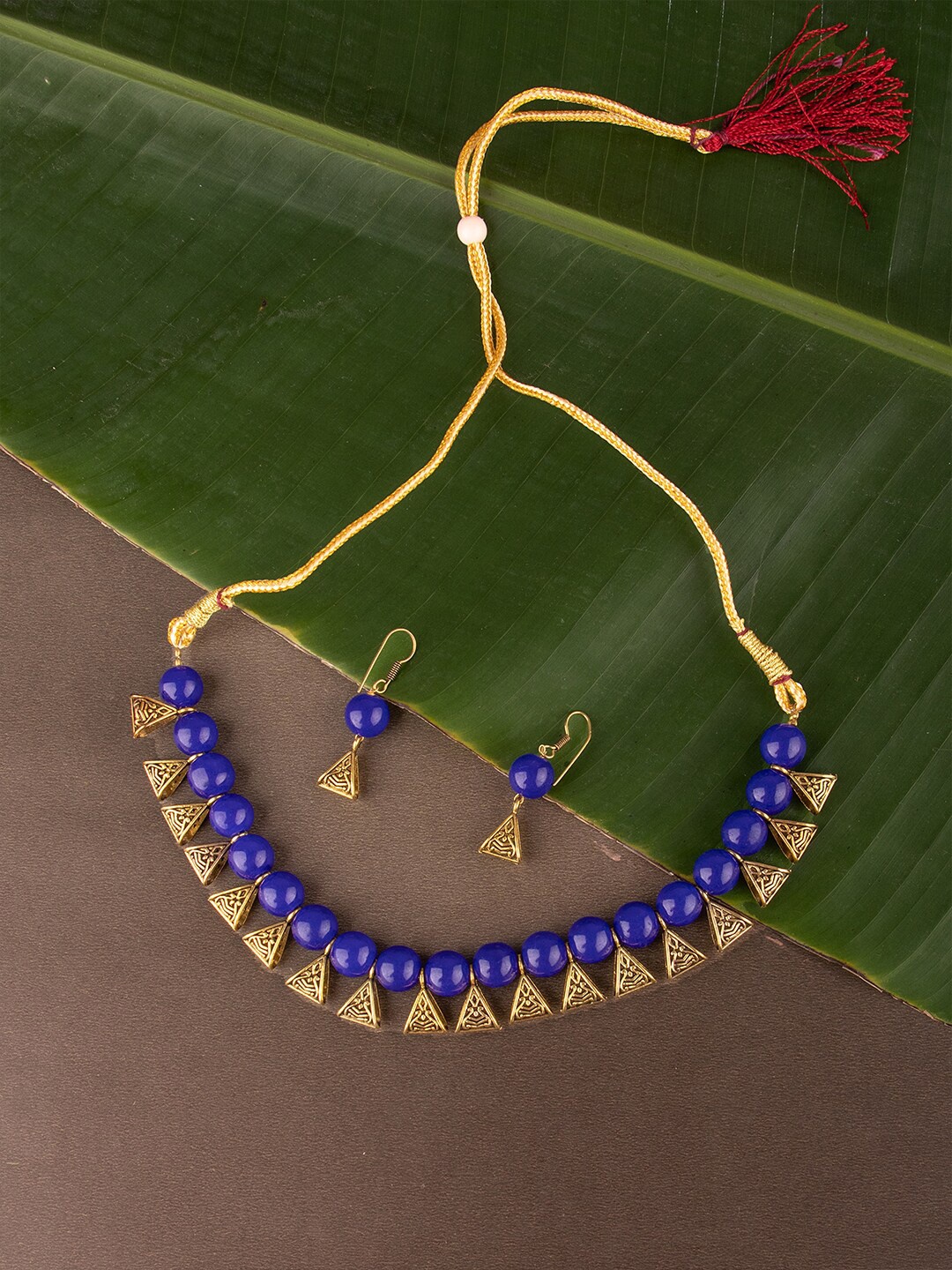 

Ozanoo Designer Blue & Gold Plated Loop Beaded Necklace Set