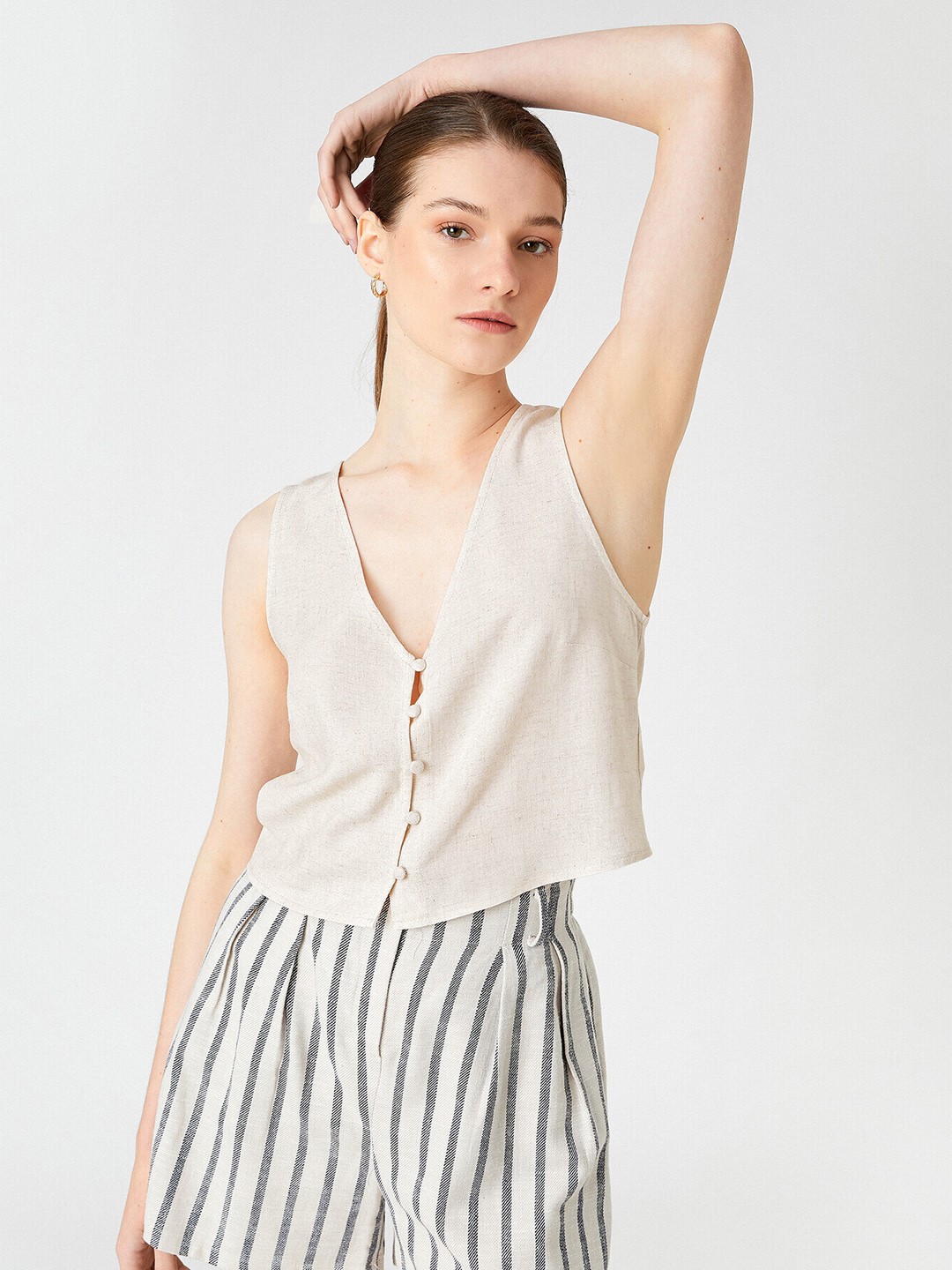 

Koton Off White Solid V-Neck Sleeveless A-Line Crop Top