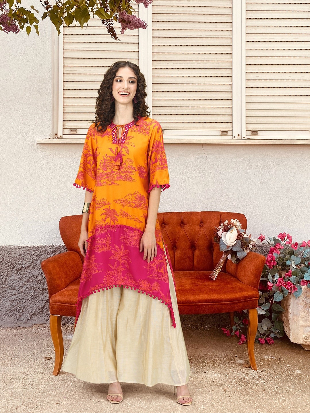 

Sangria Tropical Printed Mirror Work Detailed Dipped Hem A-Line Kurta, Magenta