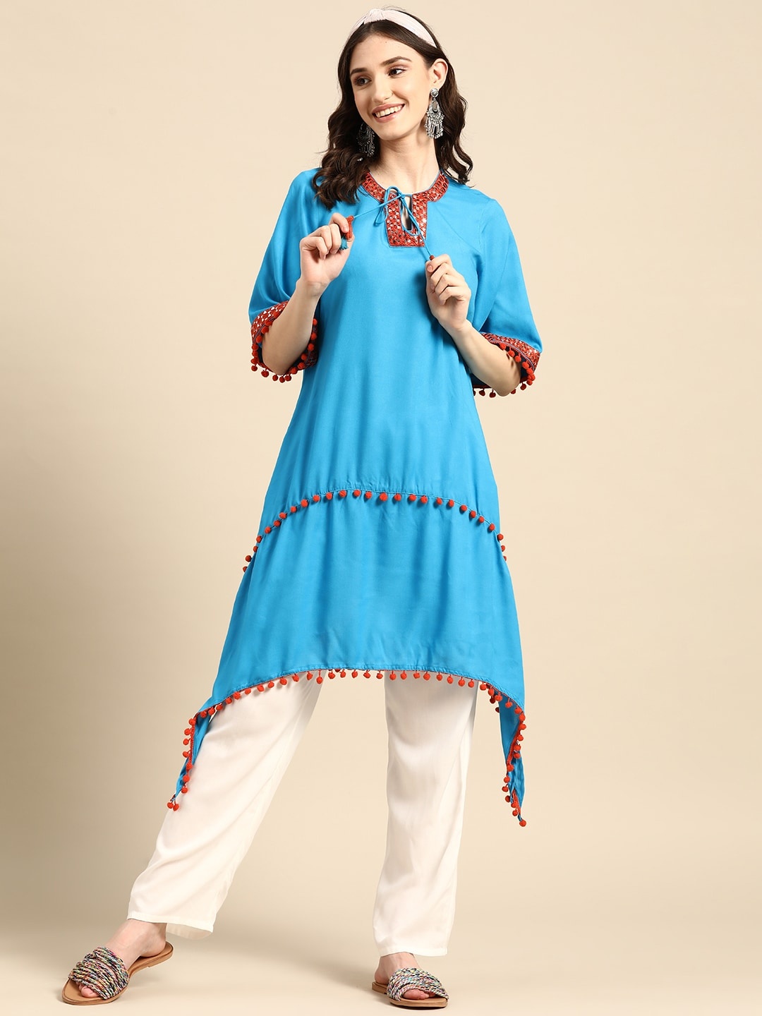 

Sangria Mirror Work & Pom-Pom Detailed Dipped Hem A-Line Kurta, Turquoise blue