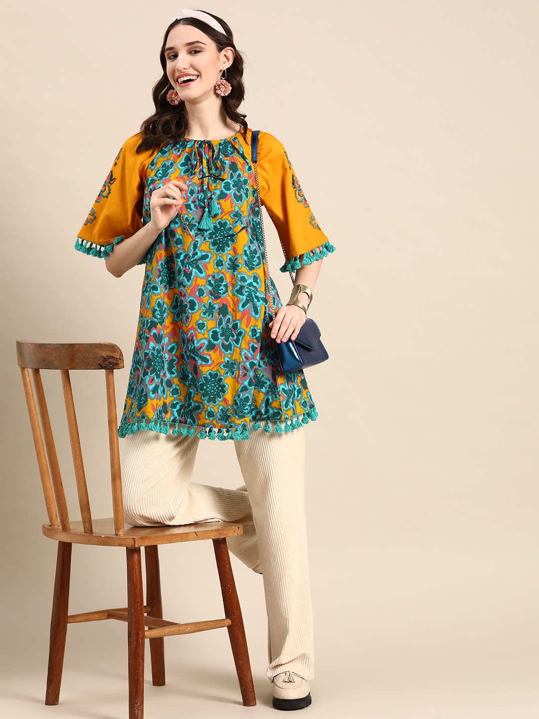 

Sangria Women Printed Tie-Up Neck A-Line Tunic with Tasselled Trims, Mustard