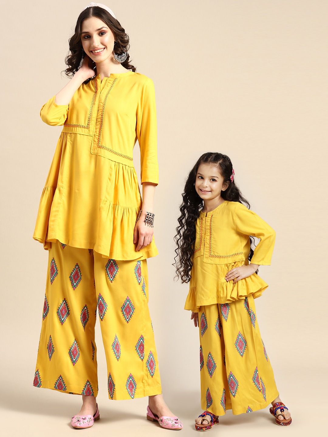 

Sangria Women Tiered Thread Work Detailed Kurti with Printed Palazzos, Mustard