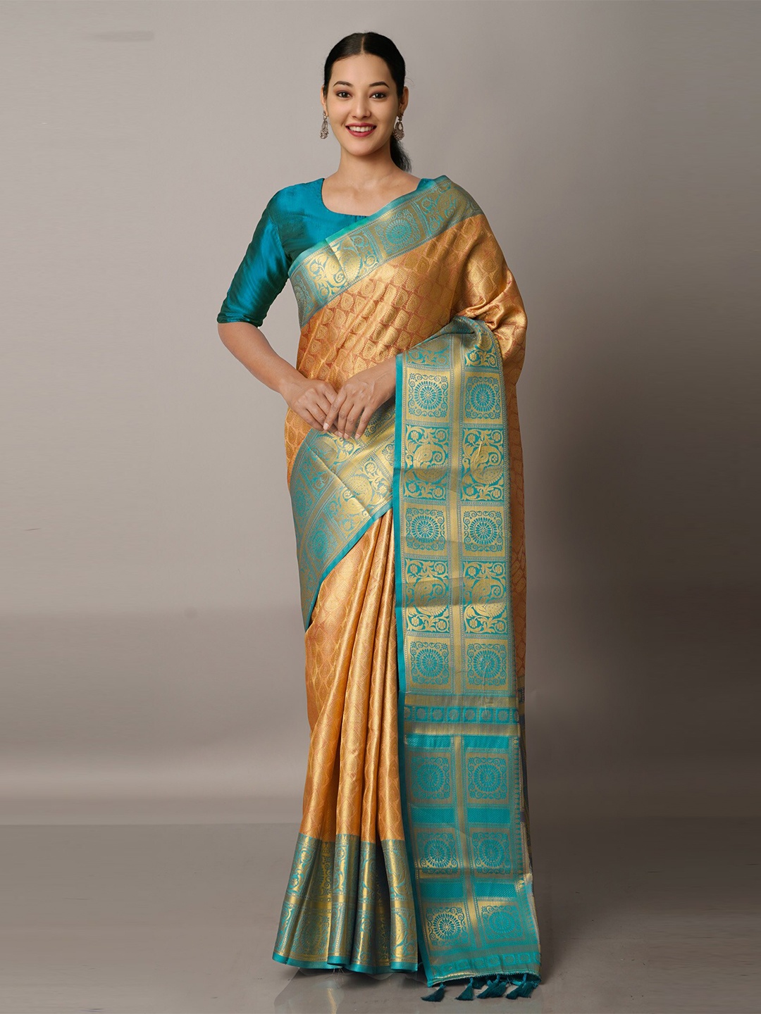 

Unnati Silks Peach-Coloured & Green Ethnic Motifs Zari Silk Blend Banarasi Saree