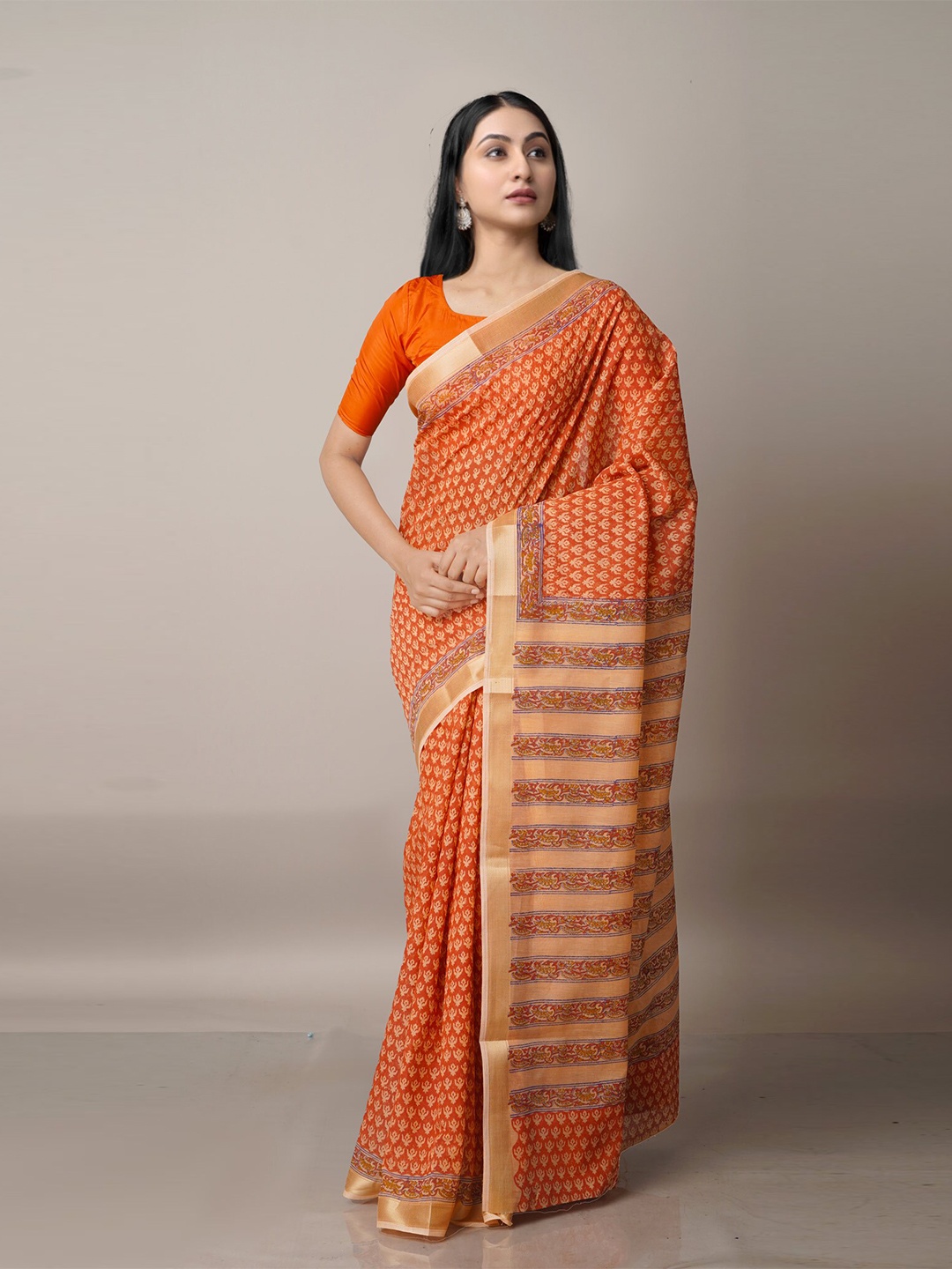 

Unnati Silks Orange & Beige Ethnic Motifs Zari Silk Cotton Chanderi Saree