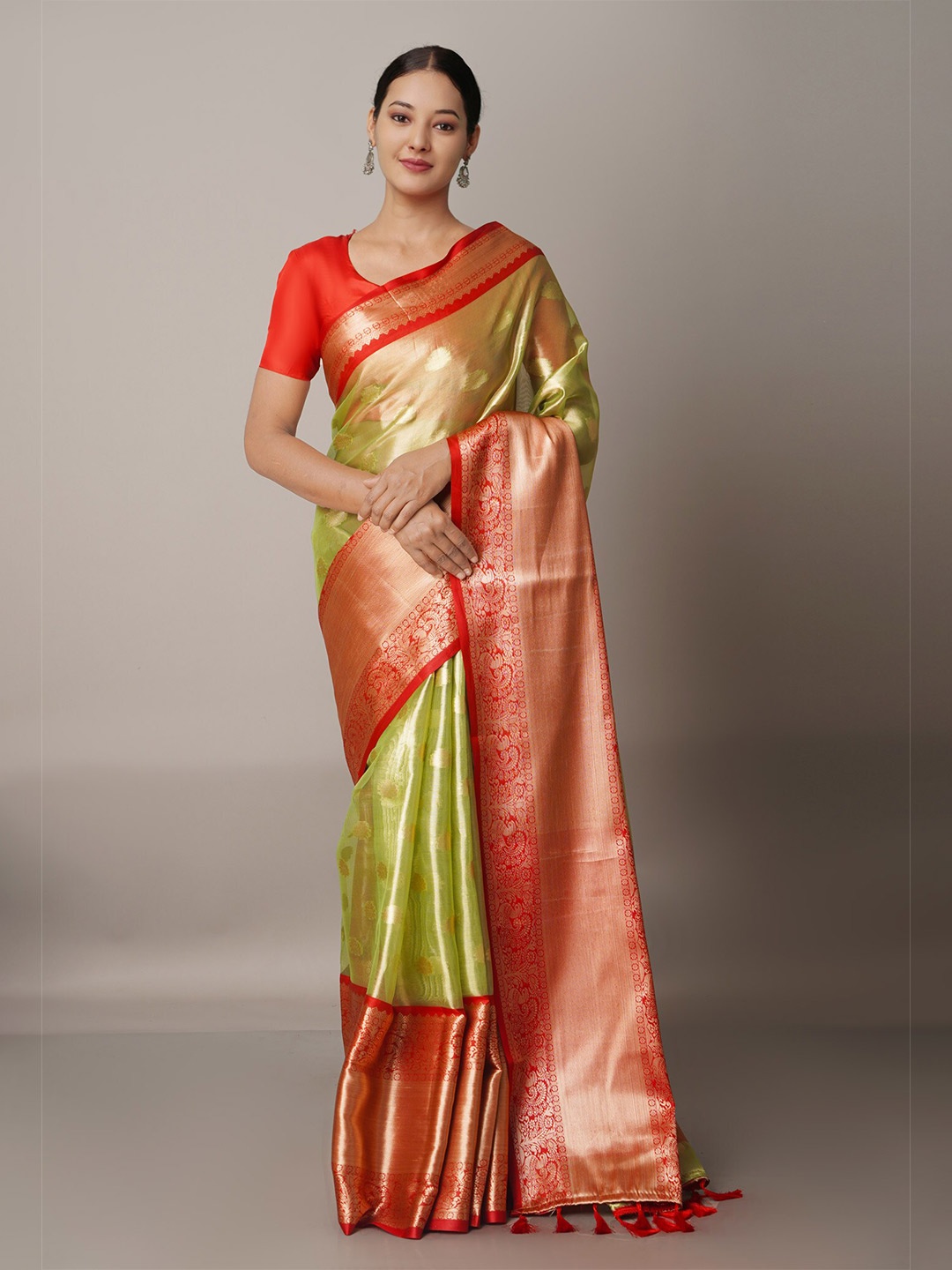 

Unnati Silks Green & Orange Ethnic Motifs Zari Organza Banarasi Saree