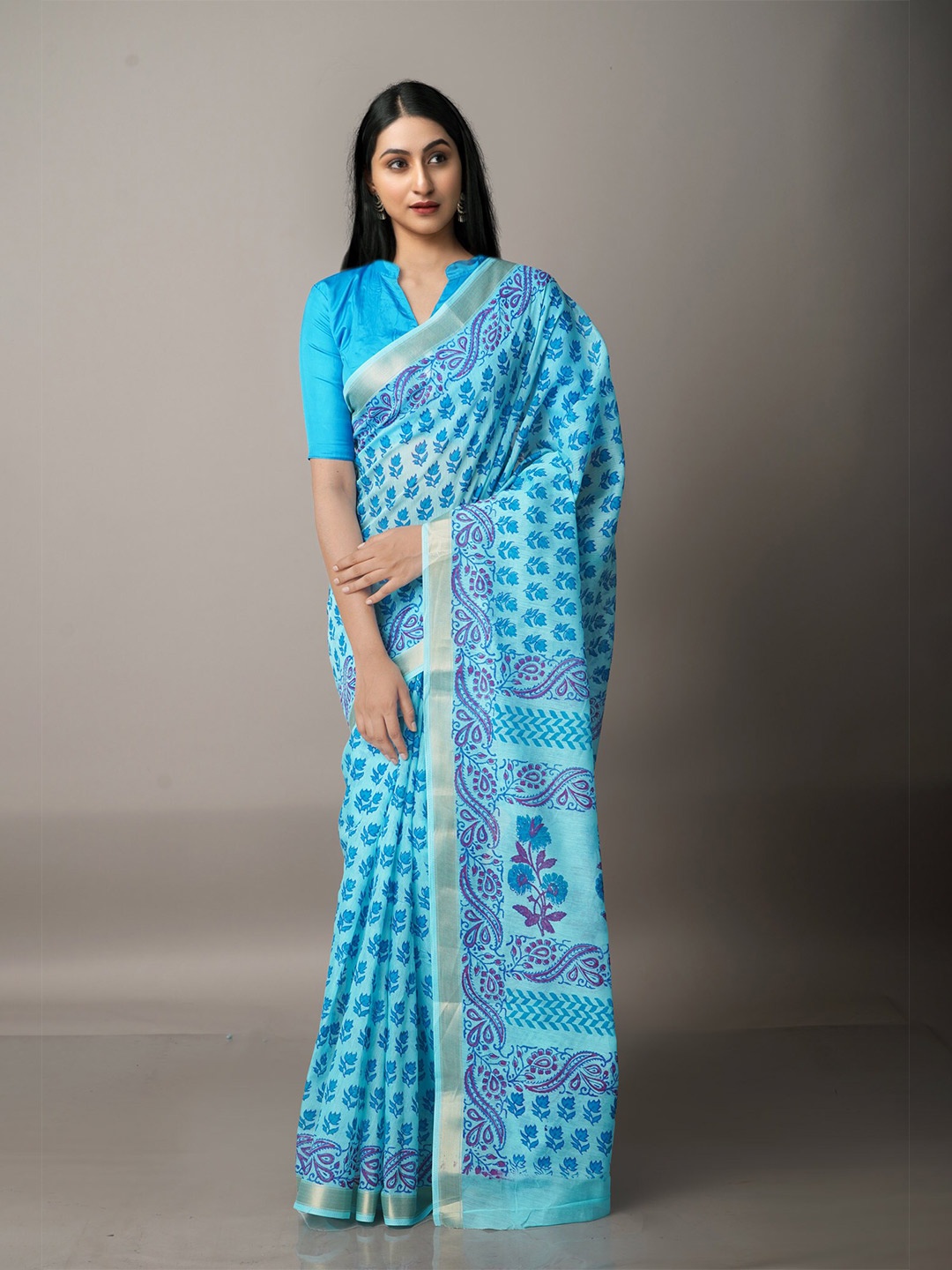 

Unnati Silks Blue & Silver-Toned Ethnic Motifs Silk Cotton Chanderi Saree