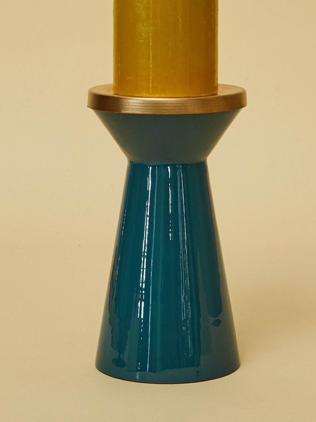 

Home Centre Teal Blue Solid Floor Candle Stand