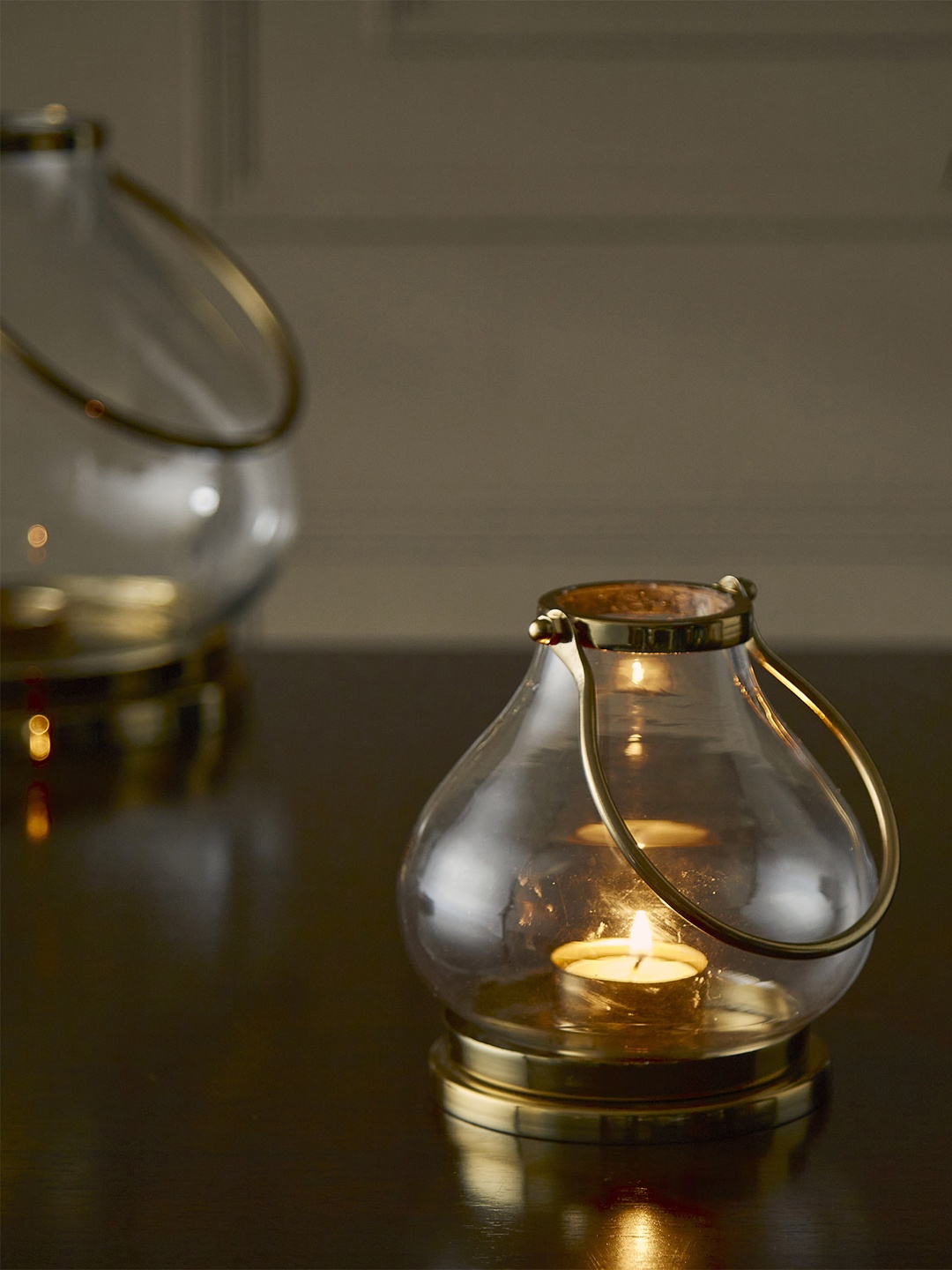 

Home Centre Gold-Toned Solid Glass Hanging Lantern