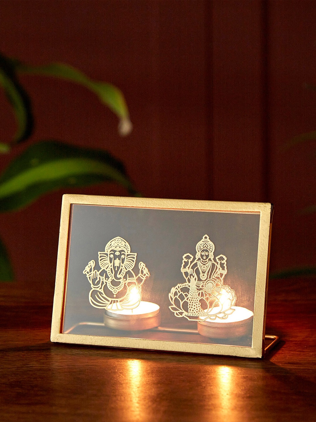 

Home Centre Gold-Toned Lakshmi & Ganesha Stencil With T-Light Holder