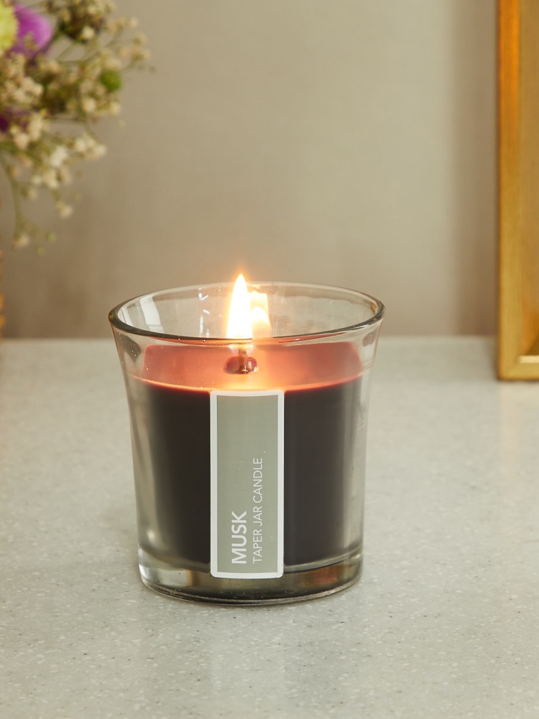 

Home Centre Grey Musk Scented Tapered Jar Candle