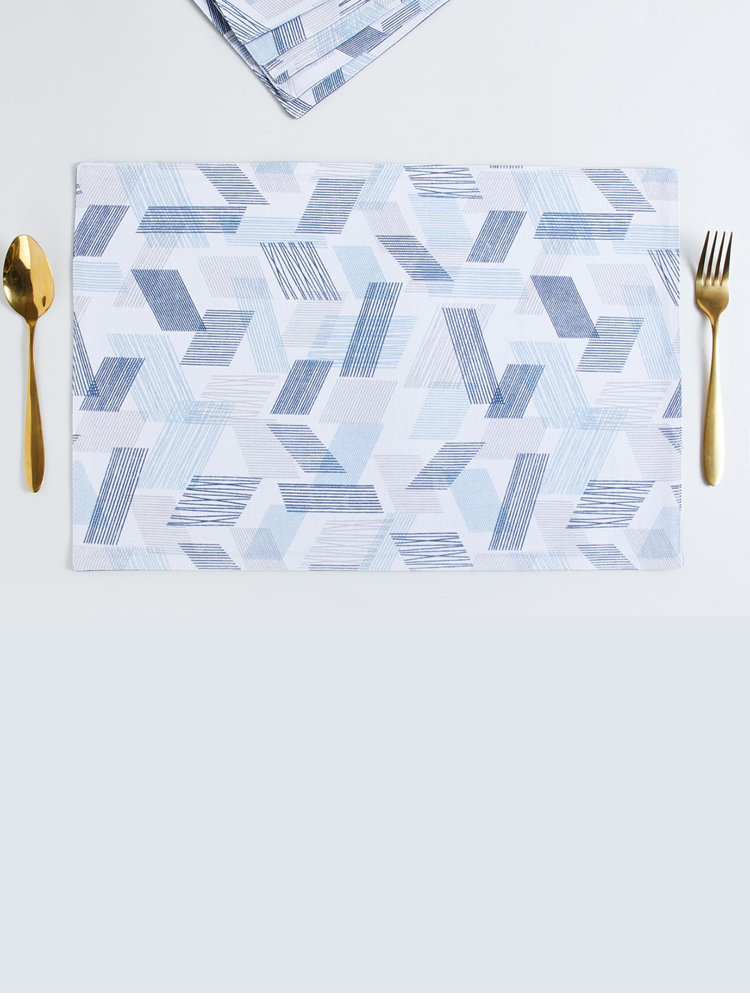 

Home Centre Blue and White Printed Cotton Placemat