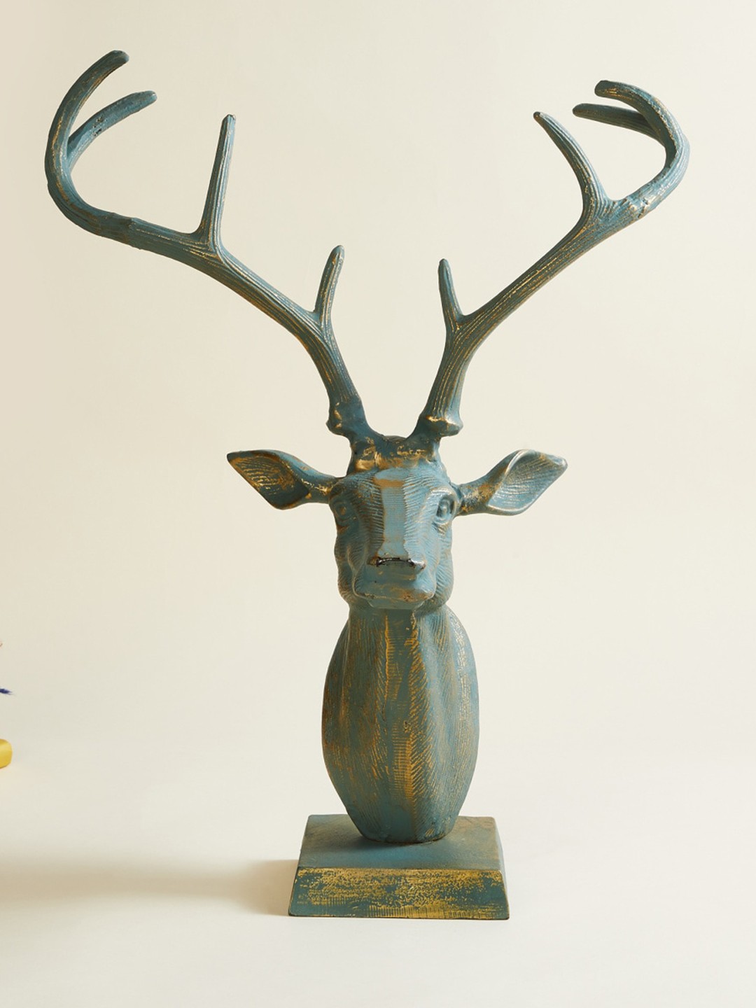 

Home Centre Blue Metal Reindeer Figurine