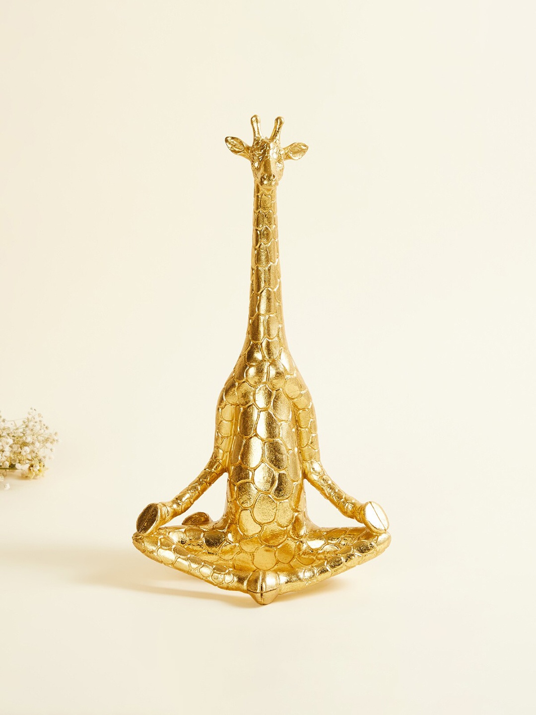 

Home Centre Gold-Toned Textured Meditating Giraffe Figurine Showpieces
