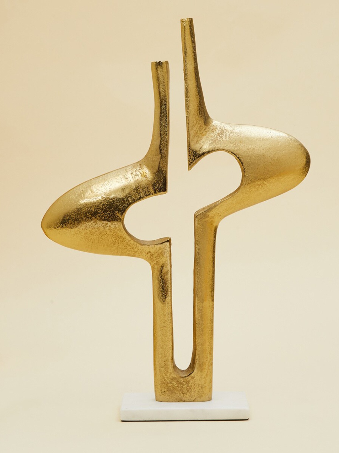 

Home Centre Gold-Toned Abstract Sculpture Figurine With Base Showpieces