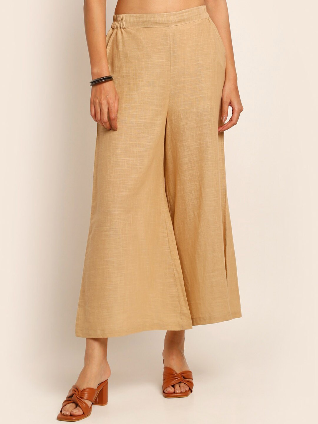 

EK BY EKTA KAPOOR Women Beige Solid Smart Flared Pure Cotton Trouser