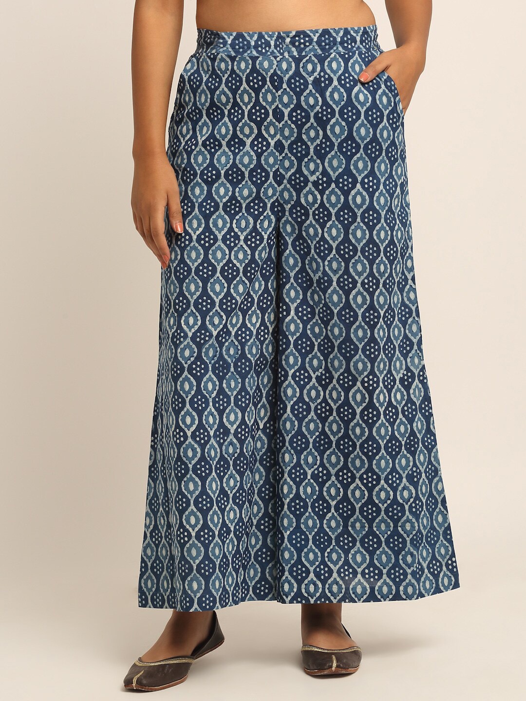 

EK BY EKTA KAPOOR Women Blue Block Printed Flared Fit Indigo Parallel Trousers