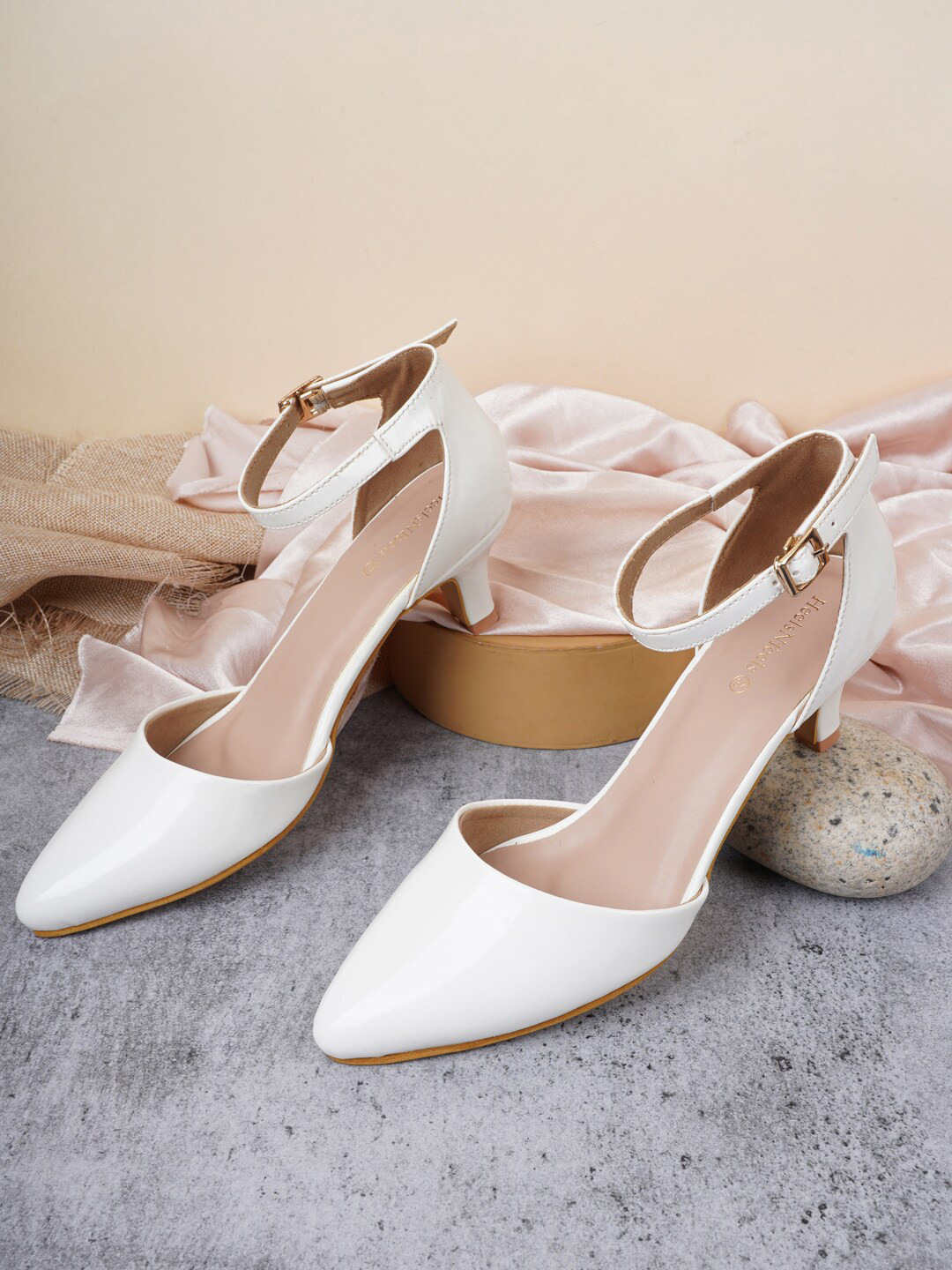 

HEELSNFEELS White Solid Kitten Pumps with Buckles