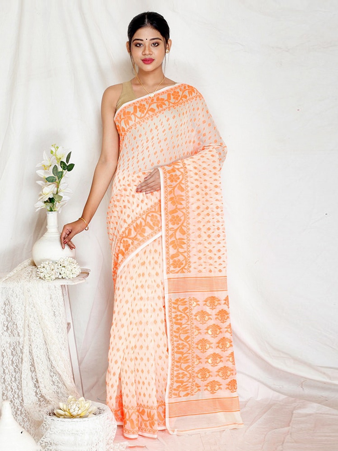 

AllSilks Cream-Coloured & Orange Ethnic Motifs Saree