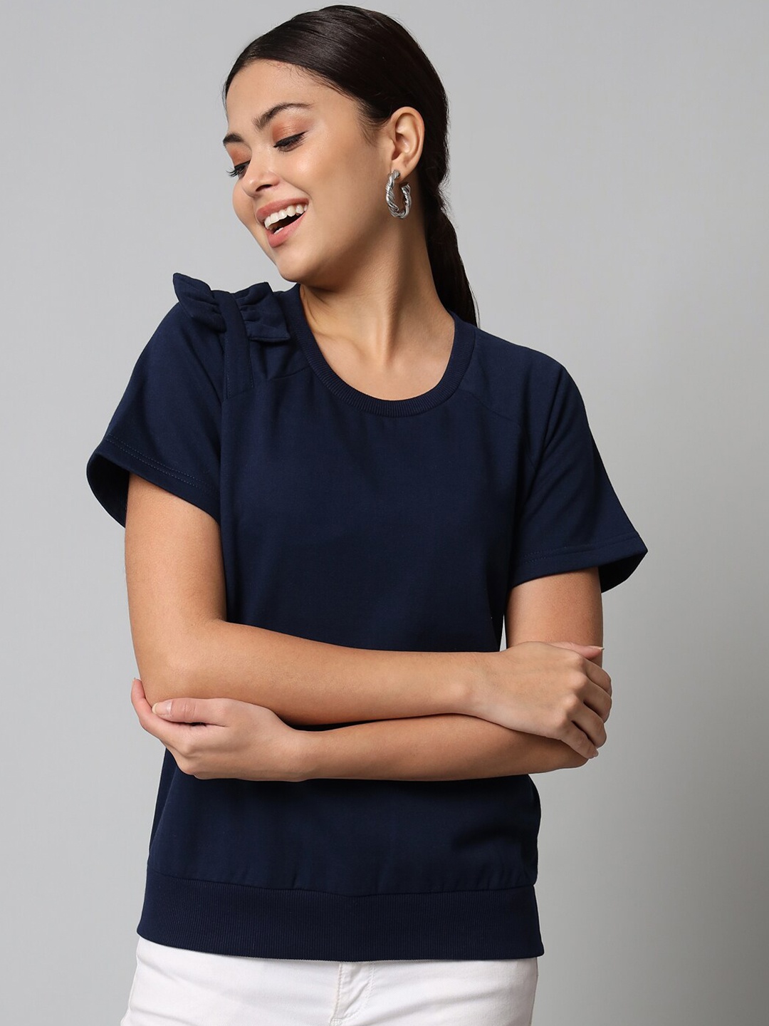 

The Vanca Women Navy Blue Bow Applique Raglan Sleeves Top