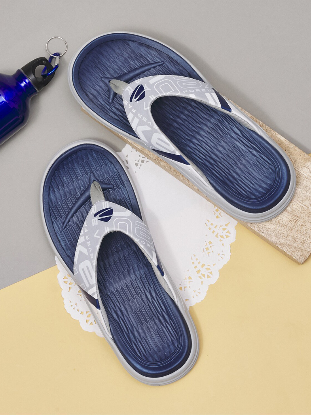 

Duke Men Grey & Navy Blue Printed Thong Flip-Flops