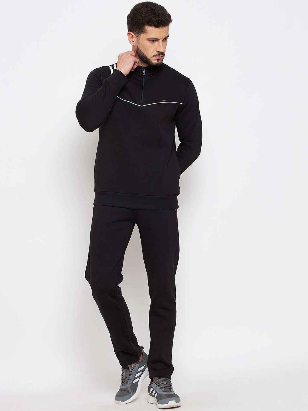 

Okane Men Black Solid Tracksuits