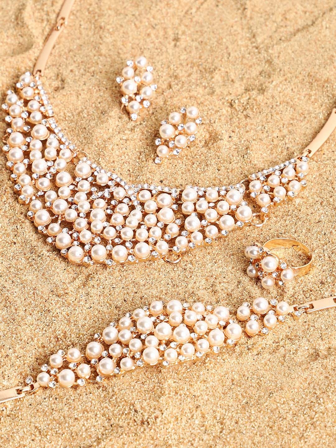 

SOHI Women Gold-Plated & Toned White Artificial Stones Studded Jewellery Set